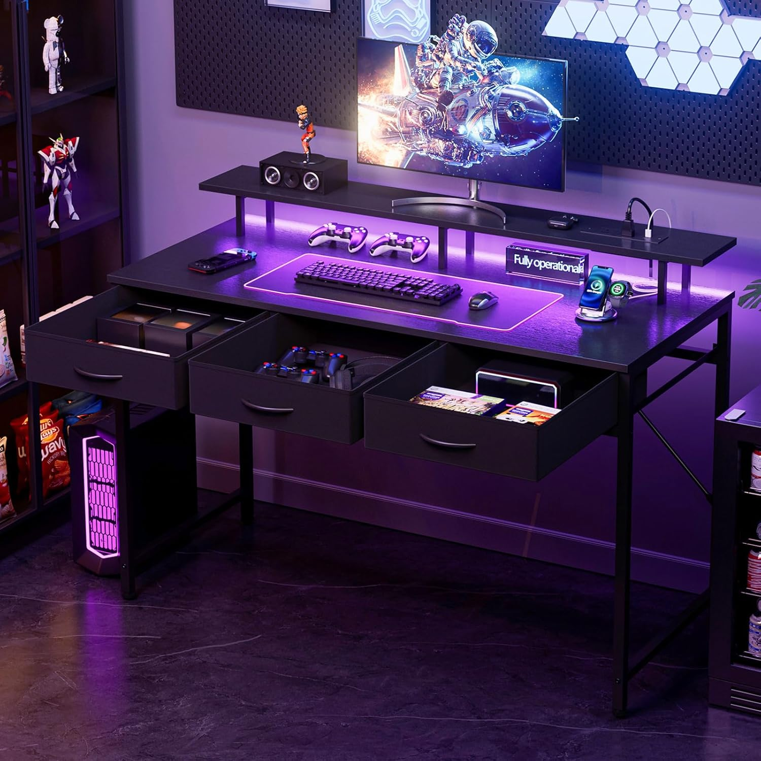 The same desk at night with purple LED glow set up for gaming