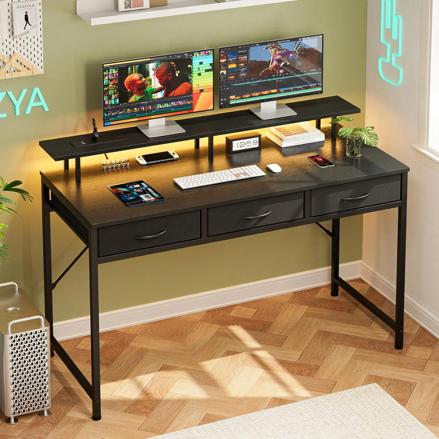 Black study desk with monitor stand and drawers set up for homework during the day