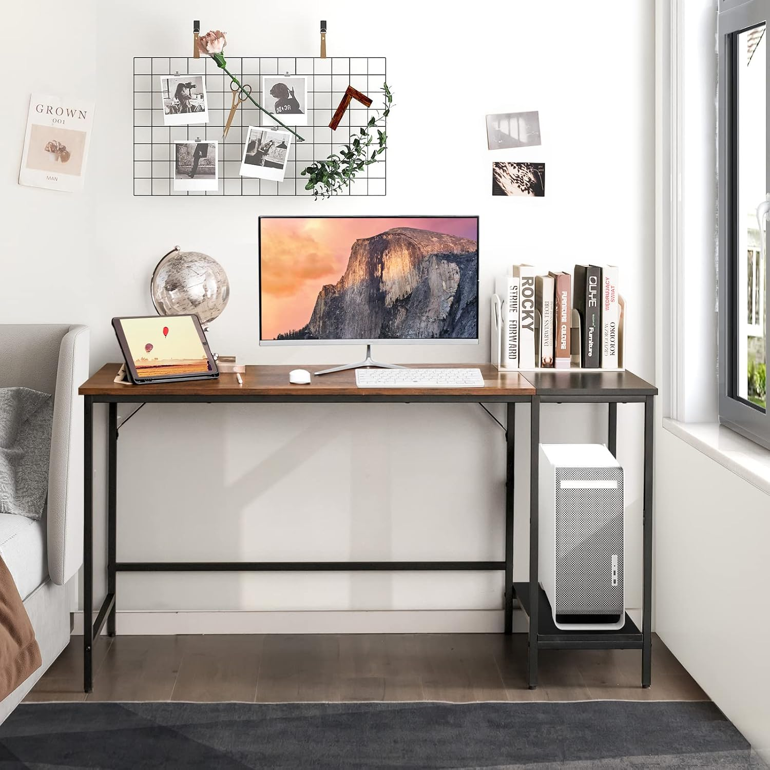 Rustic wood and black metal study desk with monitor and shelf in a bright bedroom